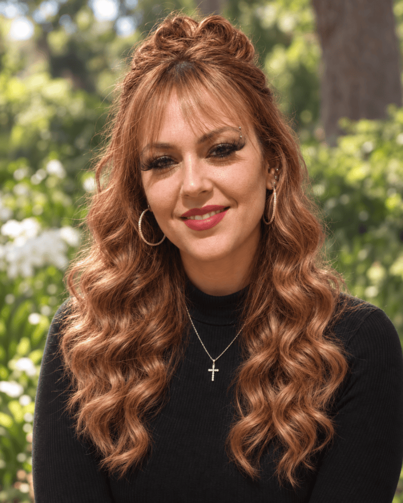 Nicole Wilkerson outdoors against a green garden background